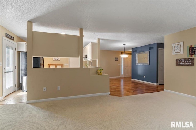 1009 Rickard Ct, Springfield, IL 62704 - unfurnished living room featuring light colored carpet and baseboards