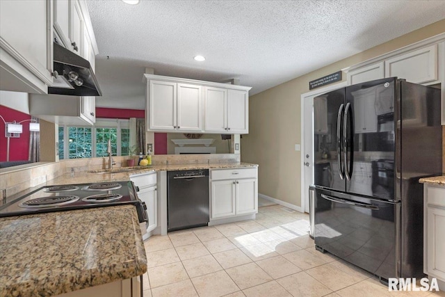 1009 Rickard Ct, Springfield, IL 62704 - kitchen featuring black appliances, a textured ceiling, recessed lighting, light stone counters, and light tile patterned floors