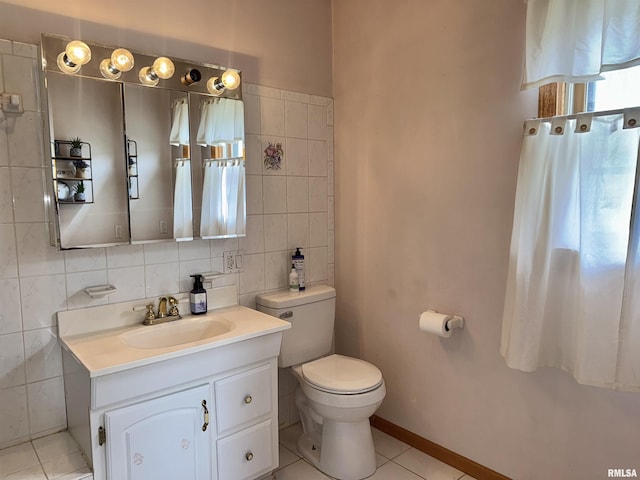 778 E Grove St, Galesburg, IL 61401 - bathroom with tile patterned flooring, vanity, and tile walls