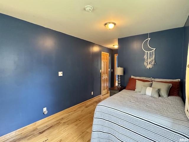 778 E Grove St, Galesburg, IL 61401 - bedroom featuring wood finished floors and a chandelier