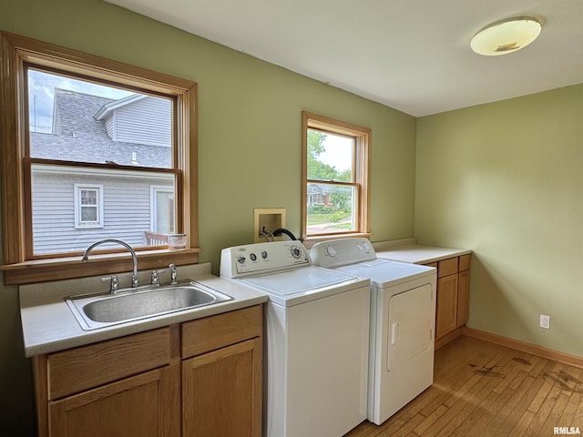 778 E Grove St, Galesburg, IL 61401 - laundry room featuring washing machine and clothes dryer, cabinet space, and light wood-type flooring