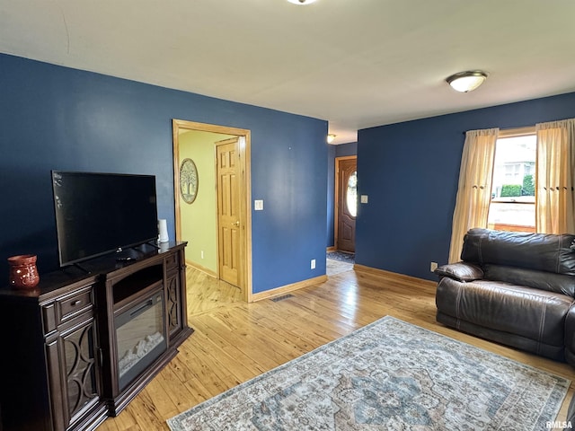 778 E Grove St, Galesburg, IL 61401 - living room with light wood-type flooring and baseboards