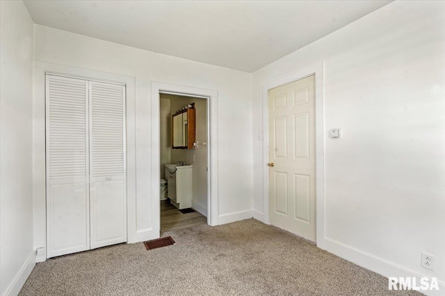 1310 Ledlie Ave, Springfield, IL 62702 - unfurnished bedroom featuring light colored carpet, a closet, and connected bathroom