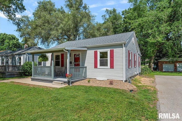 3132 S 4th St, Springfield, IL 62703 - view of front of home with a porch, a front lawn, and roof with shingles