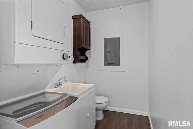 3132 S 4th St, Springfield, IL 62703 - bathroom featuring stacked washer / drying machine, electric panel, wood finished floors, and vanity