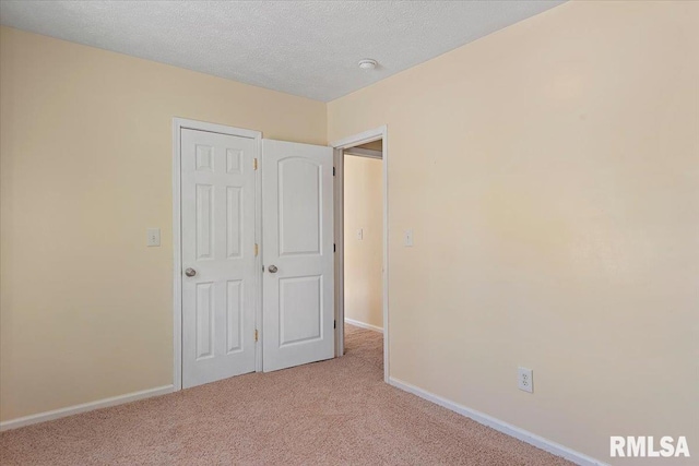 3132 S 4th St, Springfield, IL 62703 - unfurnished bedroom featuring carpet flooring and a textured ceiling