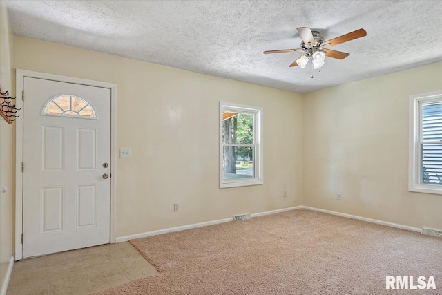 3132 S 4th St, Springfield, IL 62703 - entryway with a ceiling fan, a textured ceiling, and light carpet