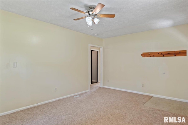 3132 S 4th St, Springfield, IL 62703 - unfurnished room with a textured ceiling, carpet floors, and ceiling fan