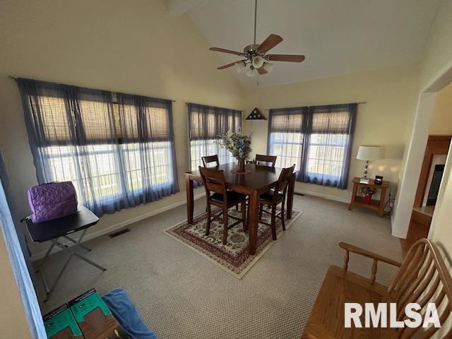 4424 Venetian Dr, Springfield, IL 62703 - carpeted dining room featuring a ceiling fan, high vaulted ceiling, and beam ceiling
