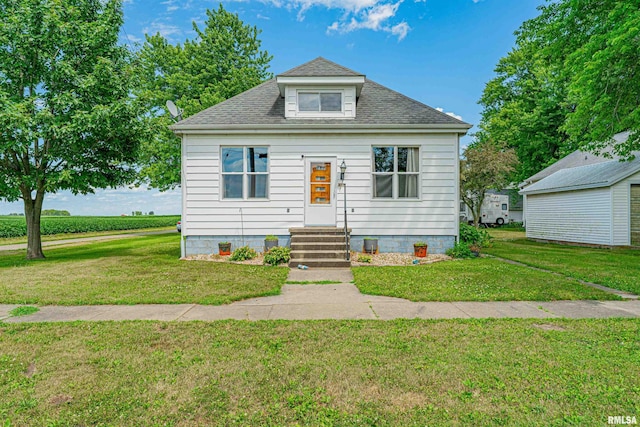 209 N 2nd St N, Easton, IL 62633 - bungalow-style home featuring a front lawn and roof with shingles