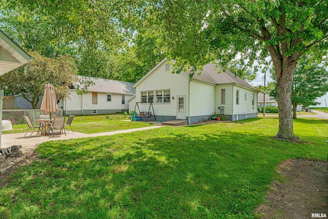 209 N 2nd St N, Easton, IL 62633 - back of house with a patio, a yard, and entry steps