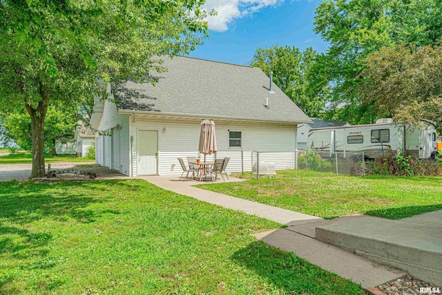 209 N 2nd St N, Easton, IL 62633 - rear view of property with roof with shingles and a patio area