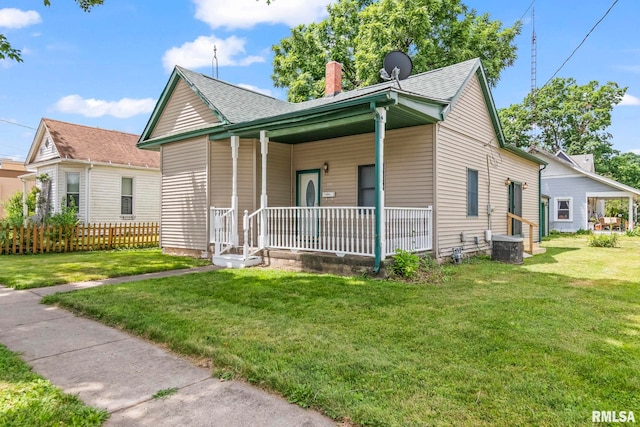 321 N 5th St, Petersburg, IL 62675 - bungalow-style home featuring a porch, a chimney, and roof with shingles