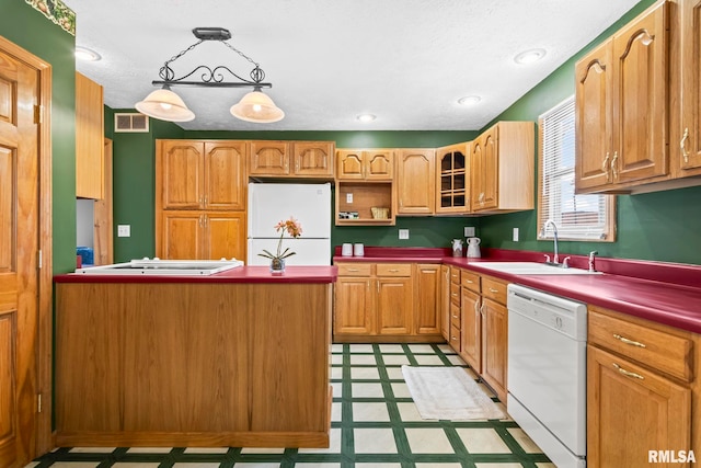 321 N 5th St, Petersburg, IL 62675 - kitchen featuring white appliances, light flooring, a peninsula, and decorative light fixtures