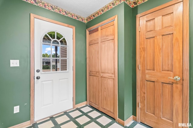 321 N 5th St, Petersburg, IL 62675 - foyer featuring baseboards and light flooring