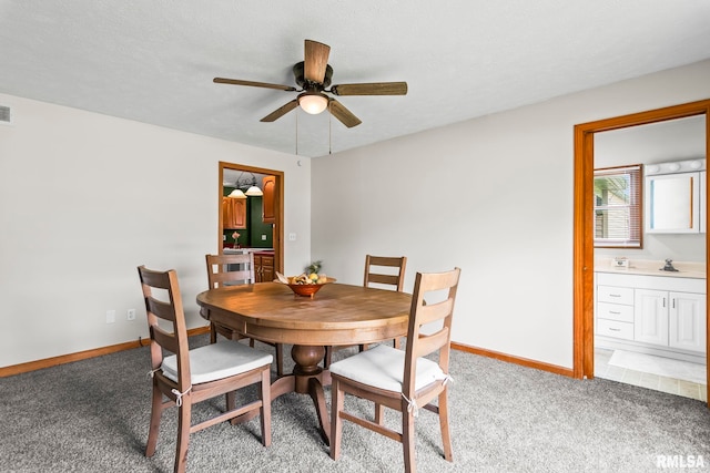 321 N 5th St, Petersburg, IL 62675 - dining room featuring a ceiling fan and light carpet