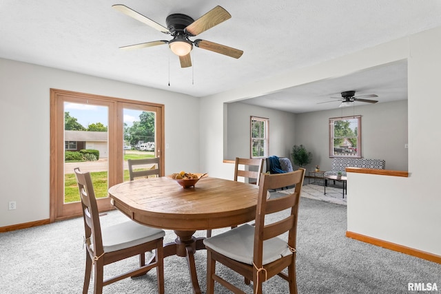 321 N 5th St, Petersburg, IL 62675 - dining space featuring light colored carpet and ceiling fan