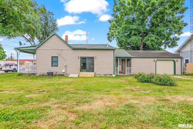 321 N 5th St, Petersburg, IL 62675 - rear view of house featuring a yard, a chimney, and entry steps