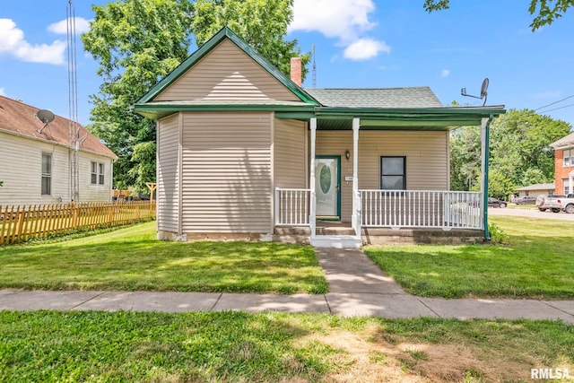 321 N 5th St, Petersburg, IL 62675 - bungalow featuring a porch and roof with shingles
