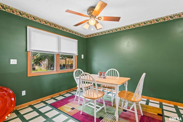 321 N 5th St, Petersburg, IL 62675 - dining room featuring ceiling fan and baseboards