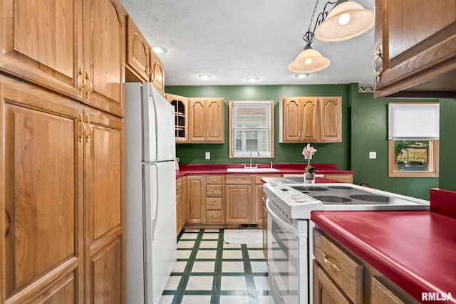 321 N 5th St, Petersburg, IL 62675 - kitchen with white appliances, light floors, decorative light fixtures, recessed lighting, and a textured ceiling