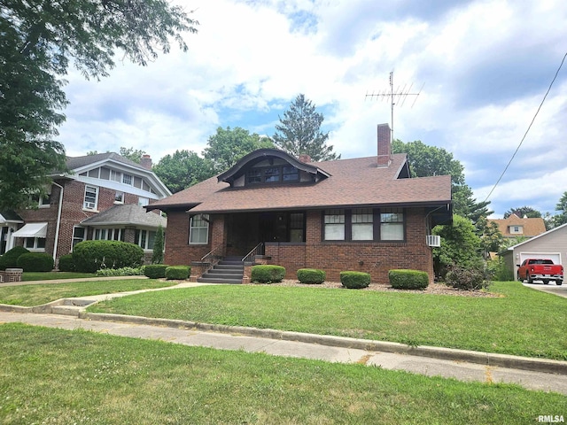 1155 N Cherry St, Galesburg, IL 61401 - bungalow-style house featuring a front yard, brick siding, and a chimney