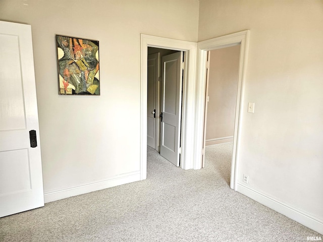 1155 N Cherry St, Galesburg, IL 61401 - unfurnished bedroom featuring carpet flooring and baseboards