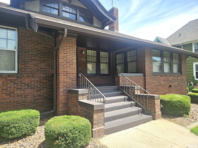 1155 N Cherry St, Galesburg, IL 61401 - entrance to property with brick siding, covered porch, and a chimney