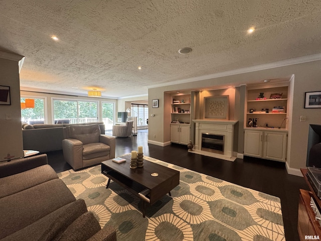 6 Ottawa Trl, Galesburg, IL 61401 - living room featuring crown molding, a textured ceiling, wood finished floors, recessed lighting, and a glass covered fireplace
