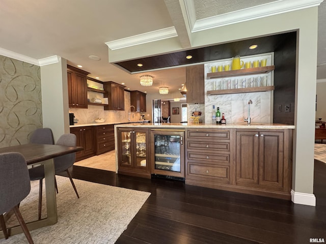 6 Ottawa Trl, Galesburg, IL 61401 - indoor wet bar featuring beverage cooler, crown molding, tasteful backsplash, dark wood-style floors, and recessed lighting