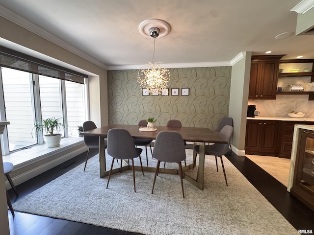 6 Ottawa Trl, Galesburg, IL 61401 - dining area with a chandelier, crown molding, and dark wood finished floors