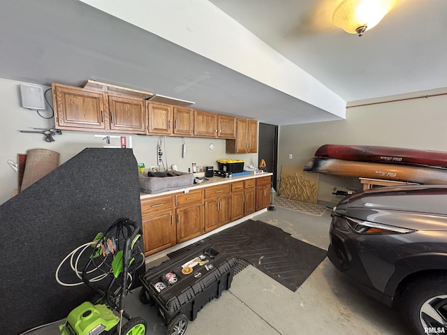 6 Ottawa Trl, Galesburg, IL 61401 - kitchen with concrete floors, brown cabinetry, and light countertops