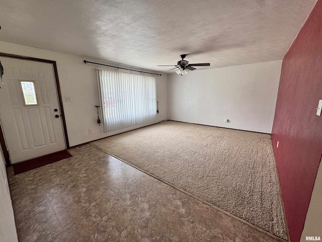1275 Sunview Dr, Canton, IL 61520 - foyer with a textured ceiling, a ceiling fan, and tile patterned floors