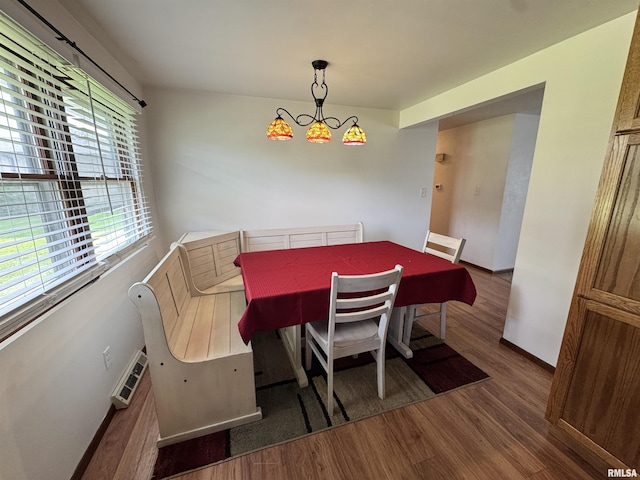 1275 Sunview Dr, Canton, IL 61520 - dining space featuring wood finished floors and a chandelier