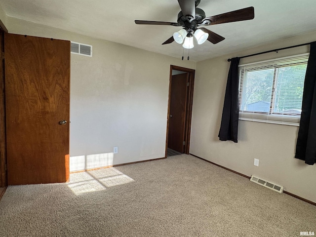 1275 Sunview Dr, Canton, IL 61520 - empty room with light carpet and a ceiling fan