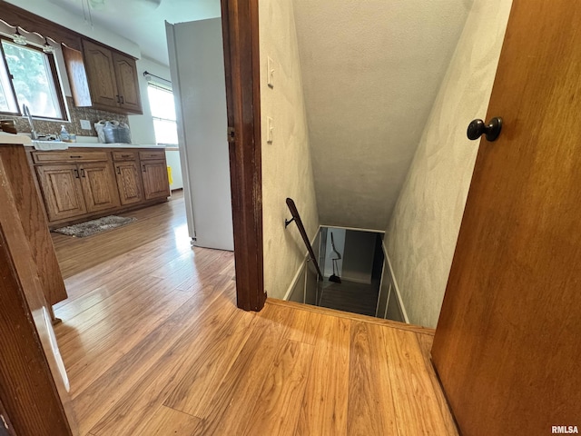 1275 Sunview Dr, Canton, IL 61520 - stairs featuring wood finished floors and a textured wall