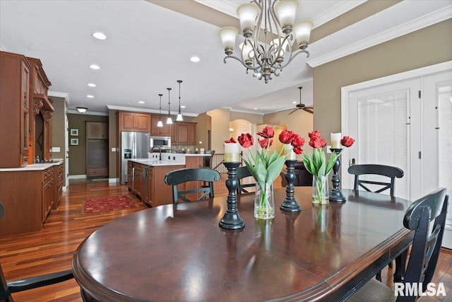 4408 Foxhall Ln, Springfield, IL 62711 - dining area with crown molding, dark wood-type flooring, recessed lighting, a chandelier, and a ceiling fan
