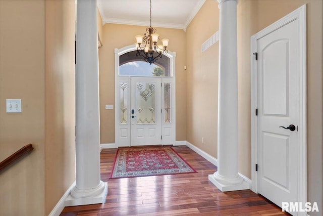 4408 Foxhall Ln, Springfield, IL 62711 - foyer entrance with decorative columns, a chandelier, ornamental molding, and wood finished floors