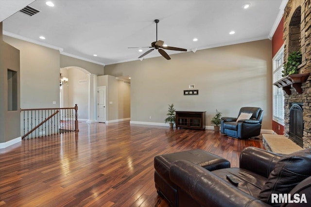 4408 Foxhall Ln, Springfield, IL 62711 - living area with a fireplace, ceiling fan, wood finished floors, ornamental molding, and ornate columns