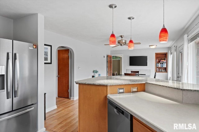 14 Beachview Ln, Springfield, IL 62712 - kitchen with stainless steel appliances, arched walkways, ceiling fan, light wood-type flooring, and pendant lighting