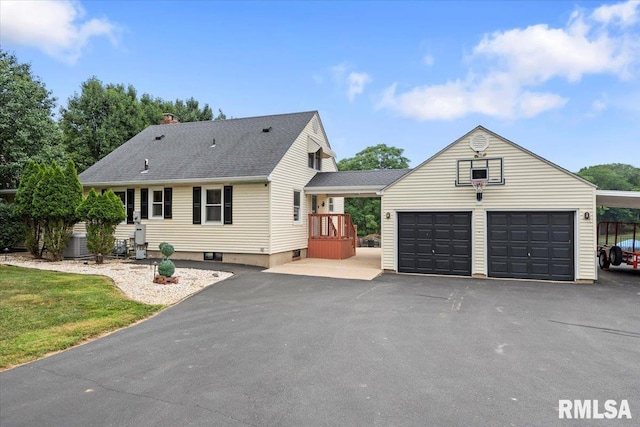 14 Beachview Ln, Springfield, IL 62712 - view of front of property featuring asphalt driveway, a shingled roof, and an outdoor structure