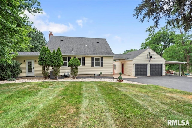14 Beachview Ln, Springfield, IL 62712 - view of front of house featuring an attached garage, a chimney, asphalt driveway, and a front yard