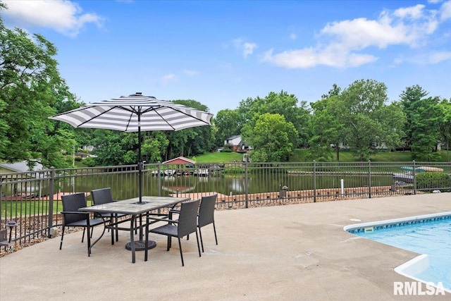 14 Beachview Ln, Springfield, IL 62712 - view of pool with a patio area, view of wooded area, outdoor dining area, and a water view