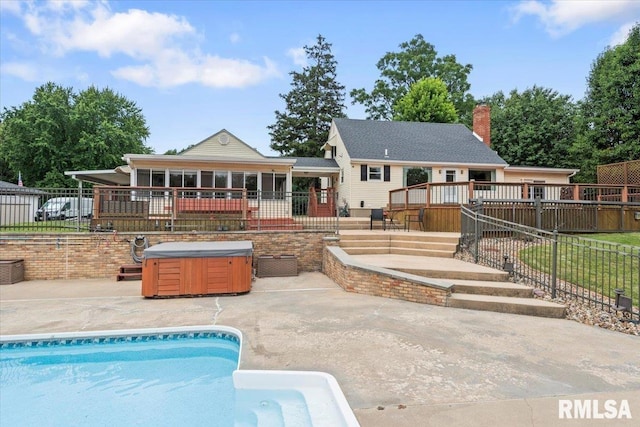14 Beachview Ln, Springfield, IL 62712 - back of property featuring a hot tub, a patio area, and a chimney