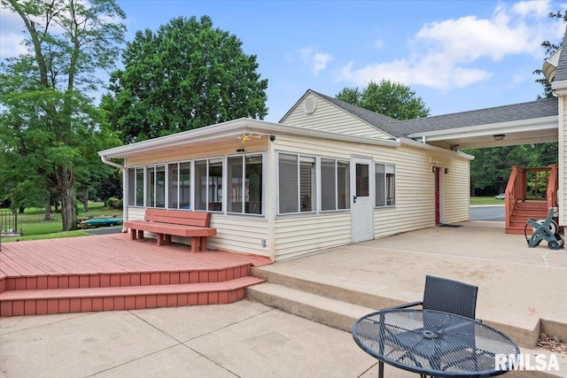 14 Beachview Ln, Springfield, IL 62712 - back of house with a sunroom, a patio, and outdoor dining space