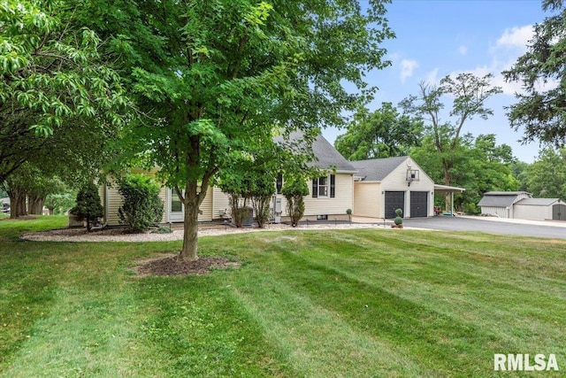 14 Beachview Ln, Springfield, IL 62712 - view of property hidden behind natural elements featuring driveway, a front yard, and a garage