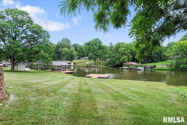 14 Beachview Ln, Springfield, IL 62712 - view of green lawn featuring a floating dock, a water view, and a shed