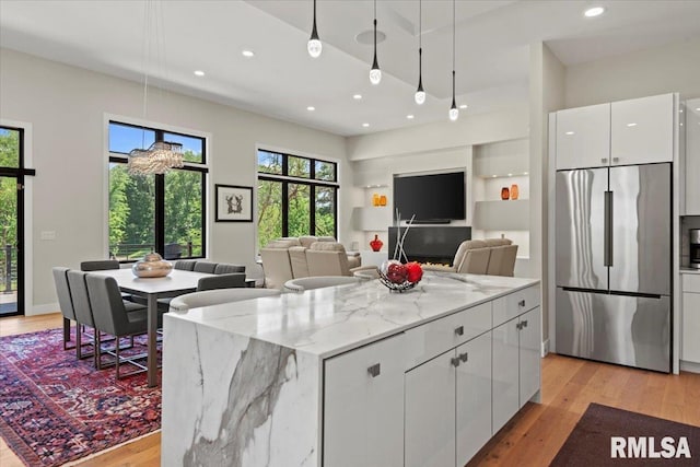2004 Grants Pond, Chatham, IL 62629 - kitchen with high quality fridge, recessed lighting, white cabinets, light wood-style floors, and pendant lighting