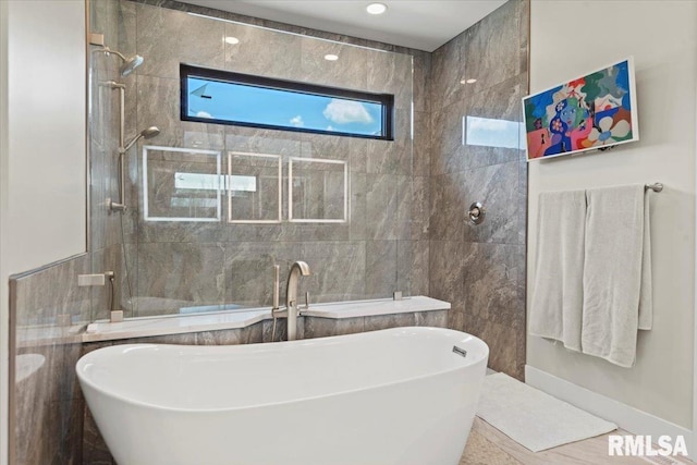 2004 Grants Pond, Chatham, IL 62629 - full bathroom with a soaking tub, tile walls, and tiled shower