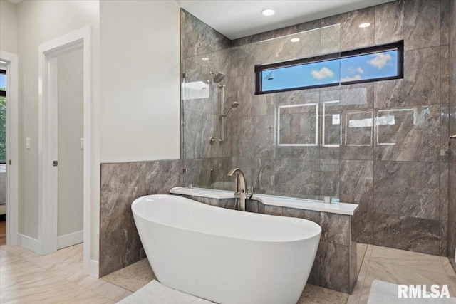 2004 Grants Pond, Chatham, IL 62629 - full bathroom with a freestanding bath, walk in shower, tile walls, and marble finish flooring